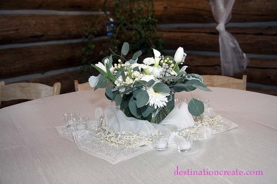 White wedding centerpiece- Evergreen Lake House: Destination Create offers full to partial wedding planning, decorating, styling, planning & specialty rentals.