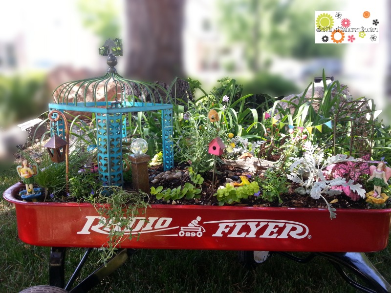 Fairy garden in little red wagon with Gypsy Garden by Genevieve Gail