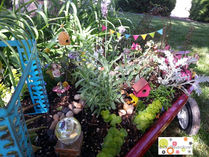 Fairy garden in little red wagon with Gypsy Garden by Genevieve Gail