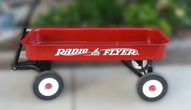 little red wagon before miniature garden