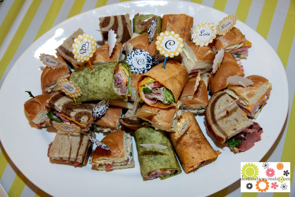 Wedding buffet-variety of wraps and mini sandwiches with DIY picks.