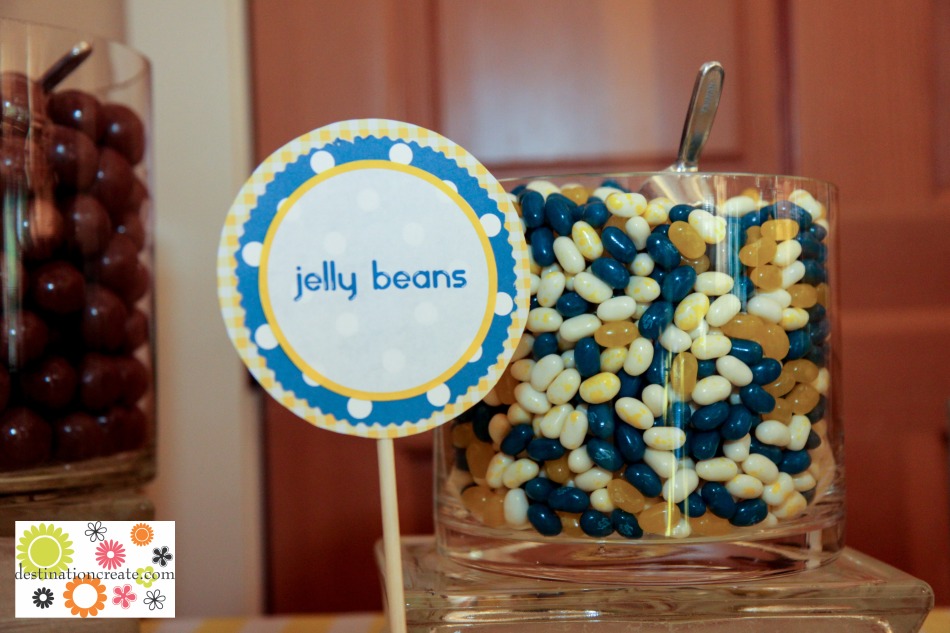 Yellow and blue wedding candy buffet with DIY signs anchored in lemons.