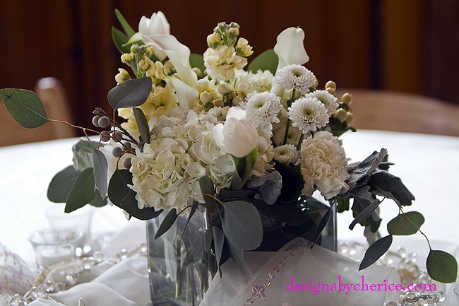 Hydrangea,roses, cremone, mini callas, tulips, button mums, hypericum berries, dusty miller and seeded eucalyptus