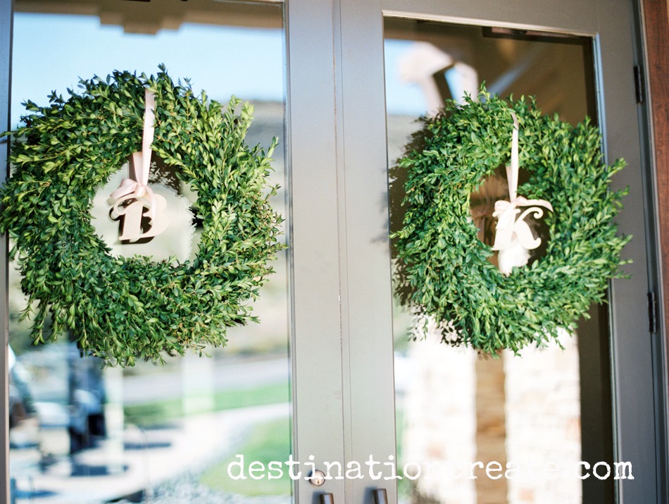 Boxwood wreaths welcome guests to this lush wedding in Golden CO