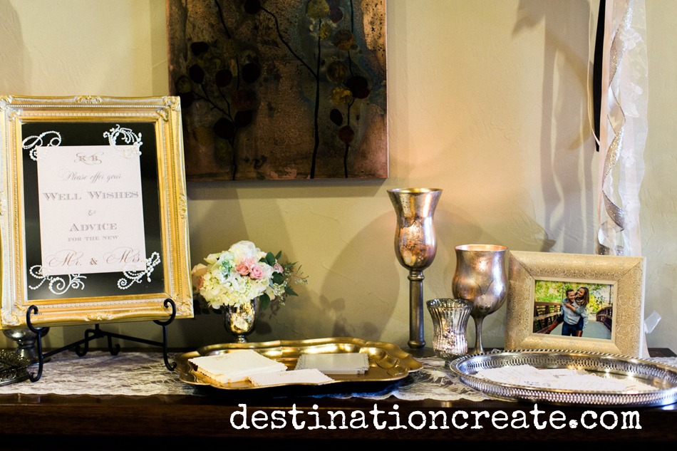 Wedding guests write their well wishes for the happy couple at this romantic blush and gold wedding in Golden Co