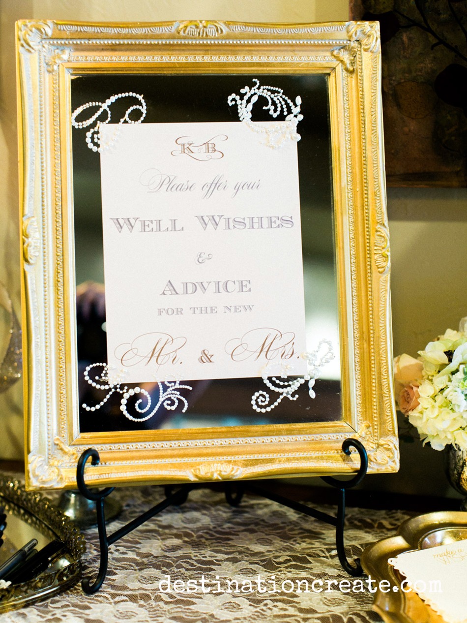 Wedding guests write their well wishes for the happy couple at this romantic blush and gold wedding in Golden Co
