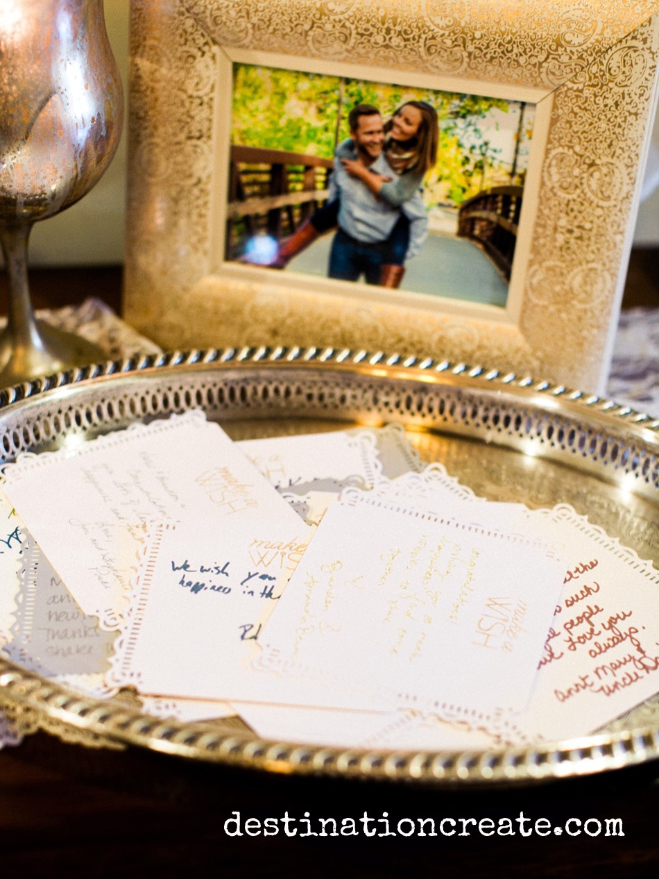 Wedding guests write their well wishes for the happy couple at this romantic blush and gold wedding in Golden Co