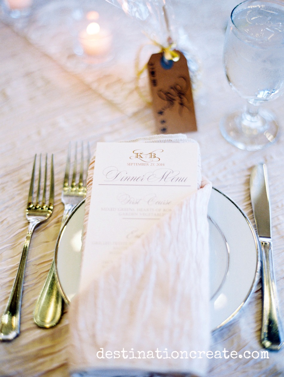A menu at each place setting hints of delights to come at this blush & gold in Golden Colorado held at Rolling Hills Country Club