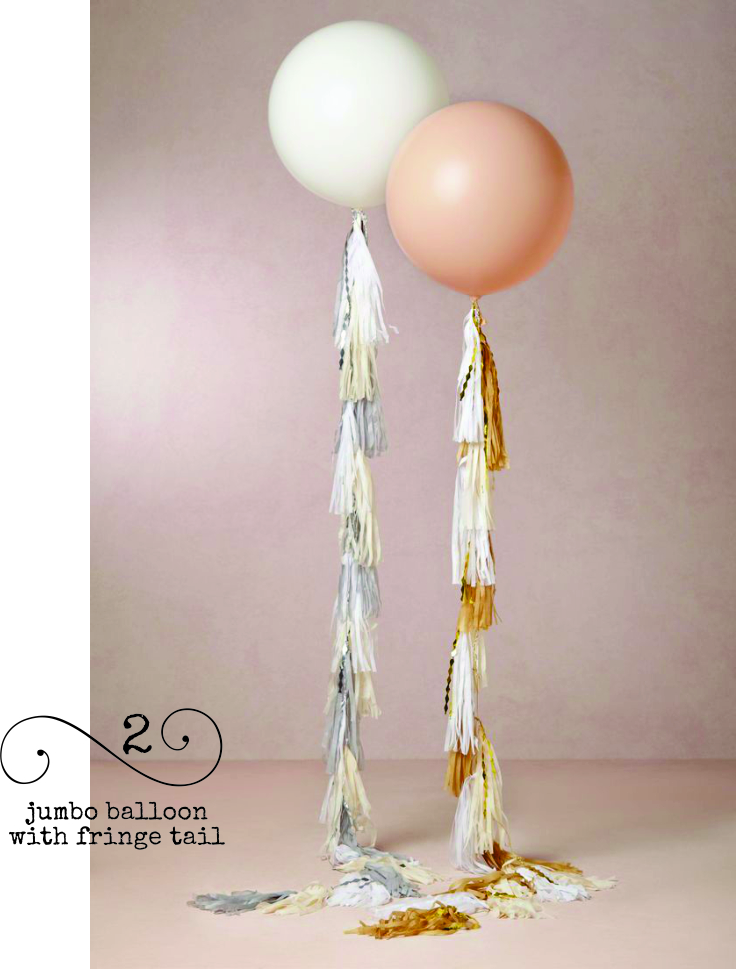 Attach a tissue tassel garland tail to a jumbo balloon for a funky centerpiece