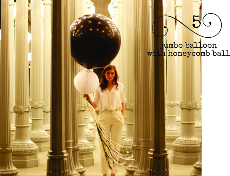 Here's some classy balloon decor... jumbo balloon with honeycomb ball & fringe tail