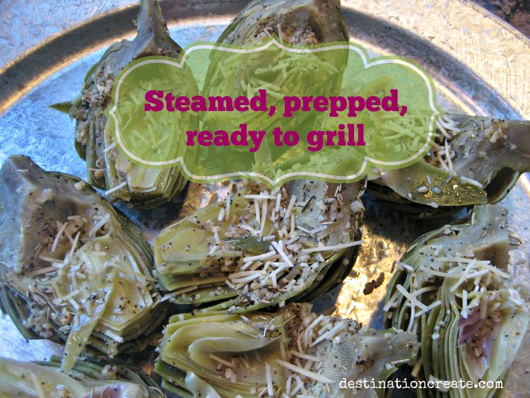 Grilled artichokes halved with chokes removed and prepped for grilling